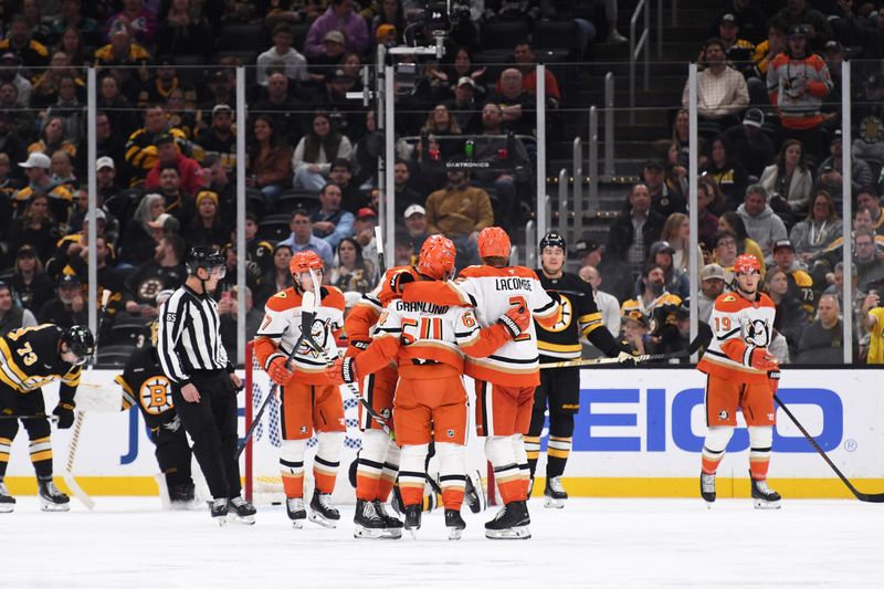 Oct 23, 2025; Boston, Massachusetts, USA; Anaheim Ducks center Mikael Granlund (64) is congratulated by his teammates after scoring a goal during the third period against the Boston Bruins at TD Garden. Mandatory Credit: Bob DeChiara-Imagn Images