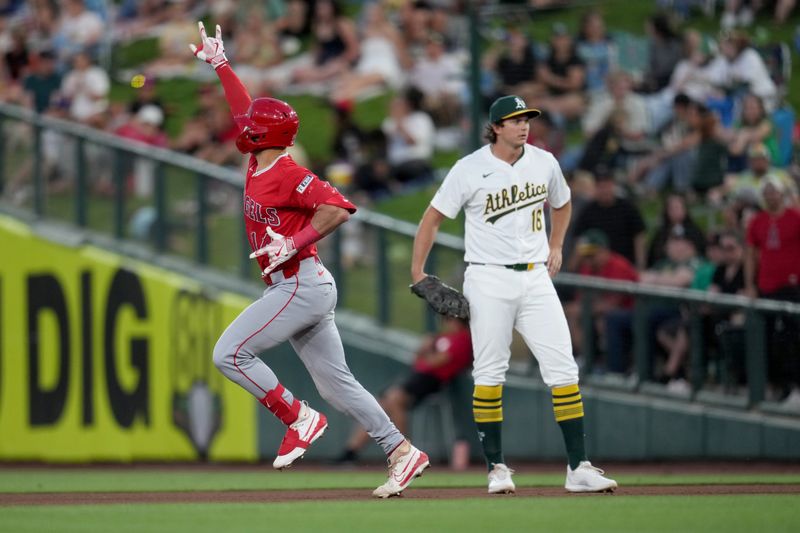 May 21, 2025; West Sacramento, California, USA; Los Angeles Angels catcher Logan O'Hoppe (14) reacts after hitting a home run against the Athletics in the fourth inning at Sutter Health Park. Mandatory Credit: Cary Edmondson-Imagn Images