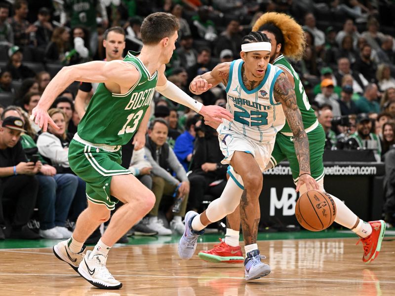 BOSTON, MASSACHUSETTS - APRIL 12: Tre Mann #23 of the Charlotte Hornets drives to the basket against Drew Peterson #13 of the Boston Celtics during the fourth quarter at the TD Garden on April 12, 2024 in Boston, Massachusetts. NOTE TO USER: User expressly acknowledges and agrees that, by downloading and or using this photograph, User is consenting to the terms and conditions of the Getty Images License Agreement. (Photo by Brian Fluharty/Getty Images)