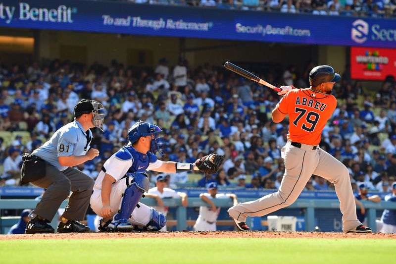 Jun 25, 2023; Los Angeles, California, USA; Houston Astros first baseman Jose Abreu (79) hits a two run home run against the Los Angeles Dodgers during the fourth inning at Dodger Stadium. Mandatory Credit: Gary A. Vasquez-USA TODAY Sports