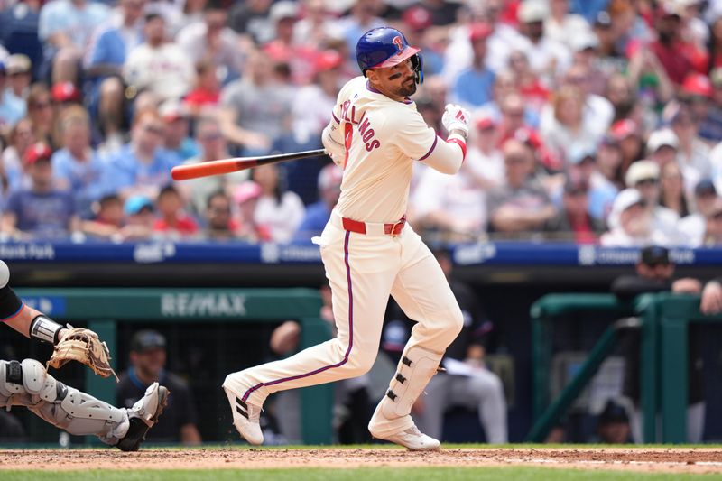 Apr 19, 2025; Philadelphia, Pennsylvania, USA; Philadelphia Phillies outfielder Nick Castellanos (8) hits a sacrifice fly against the Miami Marlins in the third inning at Citizens Bank Park. Mandatory Credit: Kyle Ross-Imagn Images