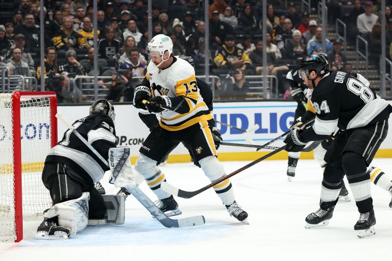Jan 20, 2025; Los Angeles, California, USA;  Pittsburgh Penguins right wing Kevin Hayes (13) scores a goal against Los Angeles Kings goaltender David Rittich (31) during the first period at Crypto.com Arena. Mandatory Credit: Kiyoshi Mio-Imagn Images