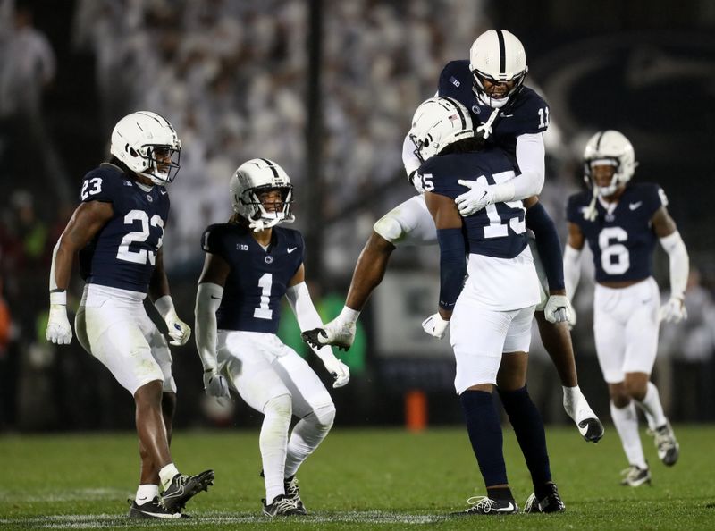 Sep 23, 2023; University Park, Pennsylvania, USA; Penn State Nittany Lions defensive end Amin Vanover (15) is congratulated by teammates after causing Iowa Hawkeyes quarterback Deacon Hill (10) (not pictured) to fumble the ball during the fourth quarter at Beaver Stadium. Penn State defeated Iowa 31-0. Mandatory Credit: Matthew O'Haren-USA TODAY Sports