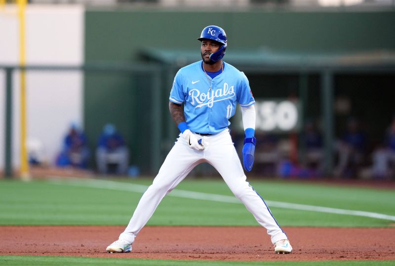 Mar 5, 2024; Surprise, Arizona, USA; Kansas City Royals third baseman Maikel Garcia (11) leads off first base against the Chicago Cubs during the first inning at Surprise Stadium. Mandatory Credit: Joe Camporeale-USA TODAY Sports