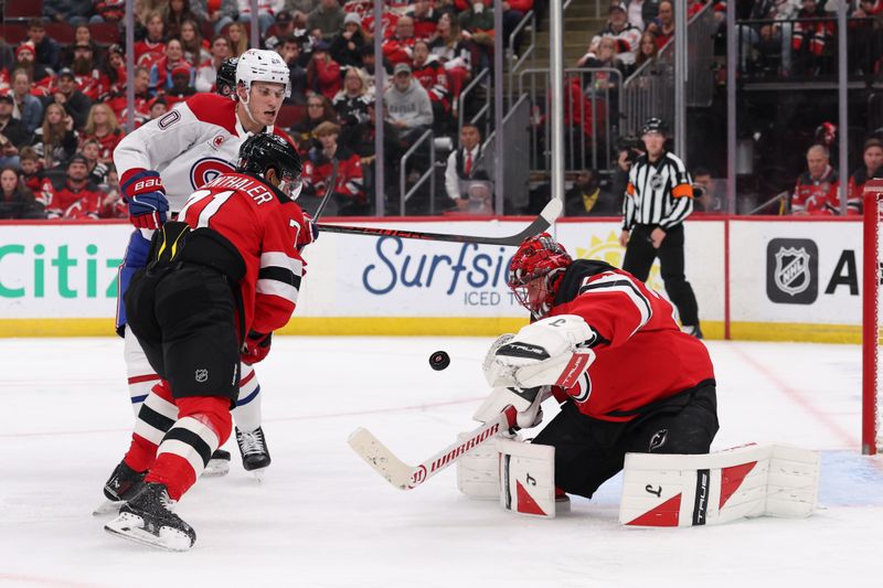 Nov 6, 2025; Newark, New Jersey, USA; New Jersey Devils goaltender Jacob Markstrom (25) makes a save against the Montreal Canadiens during the third period at Prudential Center. Mandatory Credit: Ed Mulholland-Imagn Images