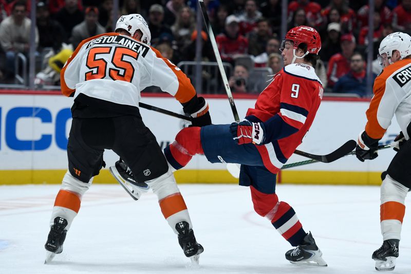 Feb 25, 2026; Washington, District of Columbia, USA; Philadelphia Flyers defenseman Rasmus Ristolainen (55) collides with Washington Capitals right wing Ryan Leonard (9) during the first period at Capital One Arena. Mandatory Credit: Hannah Foslien-Imagn Images