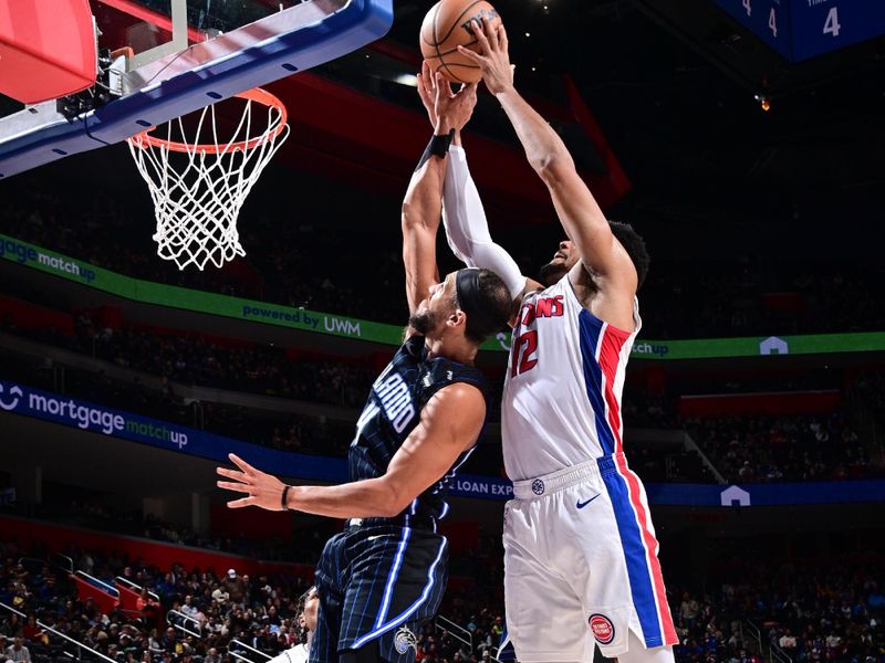 DETROIT, MI - JANUARY 1: Tobias Harris #12 of the Detroit Pistons grabs the rebound during the game against the Orlando Magic on January 1, 2025 at Little Caesars Arena in Detroit, Michigan. NOTE TO USER: User expressly acknowledges and agrees that, by downloading and/or using this photograph, User is consenting to the terms and conditions of the Getty Images License Agreement. Mandatory Copyright Notice: Copyright 2025 NBAE (Photo by Chris Schwegler/NBAE via Getty Images)