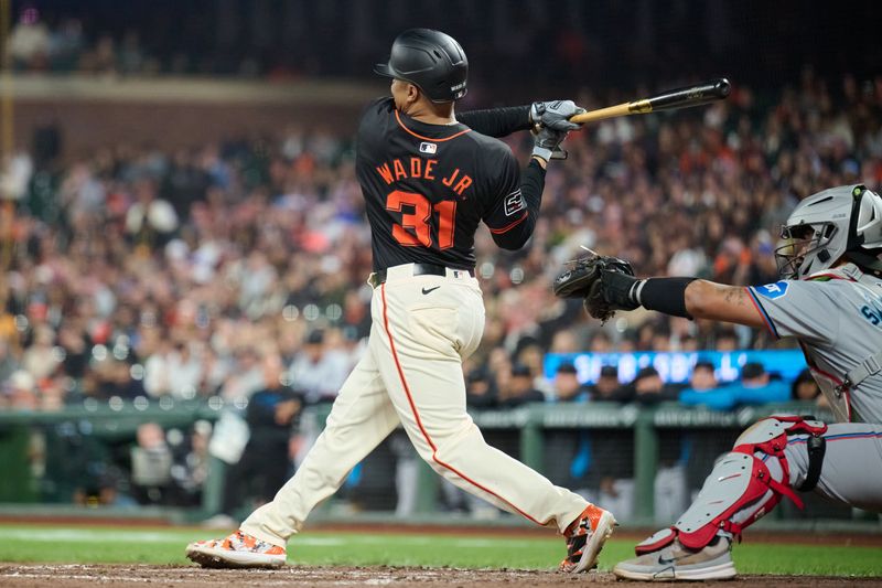 Aug 31, 2024; San Francisco, California, USA; San Francisco Giants infielder LaMonte Wade Jr. (31) strikes out to end the game against the Miami Marlins in the ninth inning at Oracle Park. Mandatory Credit: Robert Edwards-USA TODAY Sports