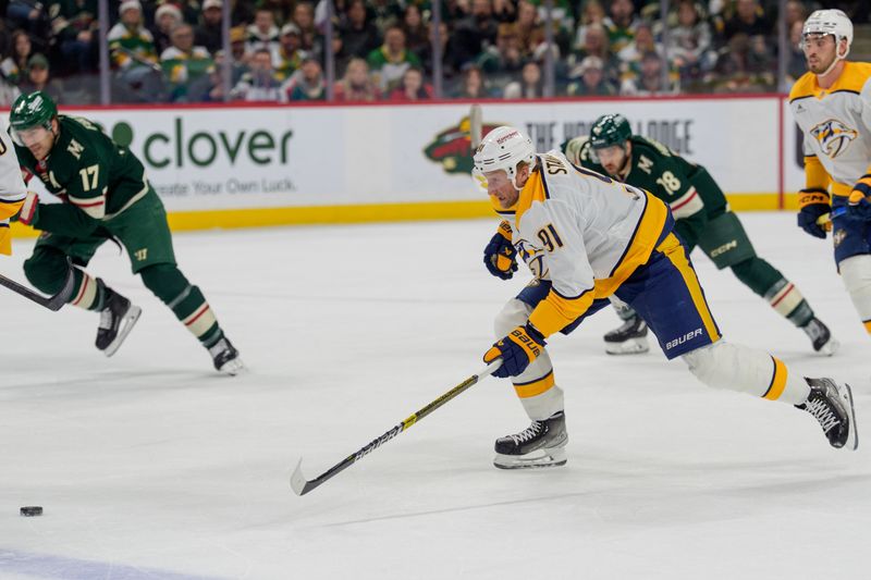 Dec 23, 2025; Saint Paul, Minnesota, USA; Nashville Predators center Steven Stamkos (91) skates on a breakaway as Minnesota Wild left wing Marcus Foligno (17) pursues in the first period at Grand Casino Arena. Mandatory Credit: Matt Blewett-Imagn Images
