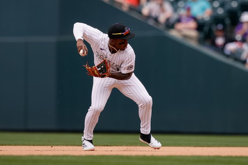 Apr 30, 2025; Denver, Colorado, USA; Colorado Rockies second baseman Adael Amador (1) fields the ball in the eighth inning against the Atlanta Braves at Coors Field. Mandatory Credit: Isaiah J. Downing-Imagn Images