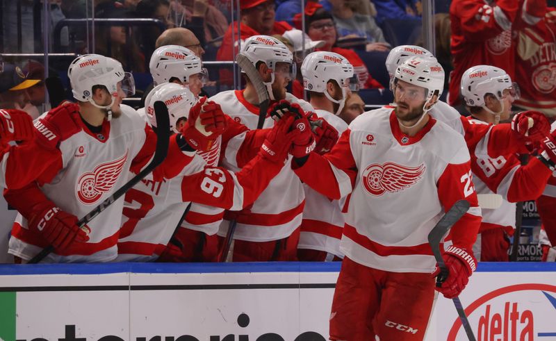 Oct 26, 2024; Buffalo, New York, USA;  Detroit Red Wings center Michael Rasmussen (27) celebrates his goal with teammates during the second period against the Buffalo Sabres at KeyBank Center. Mandatory Credit: Timothy T. Ludwig-Imagn Images