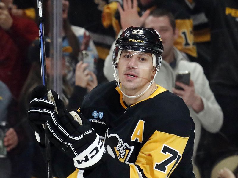 Oct 16, 2024; Pittsburgh, Pennsylvania, USA; Pittsburgh Penguins center Evgeni Malkin (71) reacts after scoring NHL career goal number 500 against the Buffalo Sabres during the third period at PPG Paints Arena. Mandatory Credit: Charles LeClaire-Imagn Images