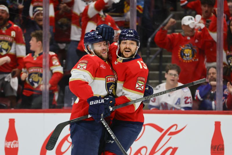 May 26, 2024; Sunrise, Florida, USA; Florida Panthers center Sam Reinhart (13) celebrates with center Carter Verhaeghe (23) after scoring against the New York Rangers during the first period in game three of the Eastern Conference Final of the 2024 Stanley Cup Playoffs at Amerant Bank Arena. Mandatory Credit: Sam Navarro-USA TODAY Sports