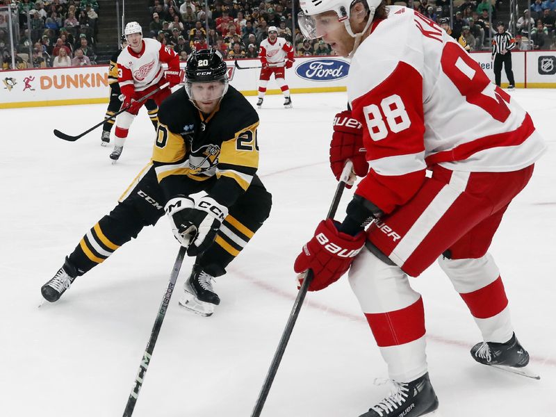 Mar 17, 2024; Pittsburgh, Pennsylvania, USA;  Detroit Red Wings right wing Patrick Kane (88) handles the puck as Pittsburgh Penguins center Lars Eller (20) defends during the second period at PPG Paints Arena. Mandatory Credit: Charles LeClaire-USA TODAY Sports