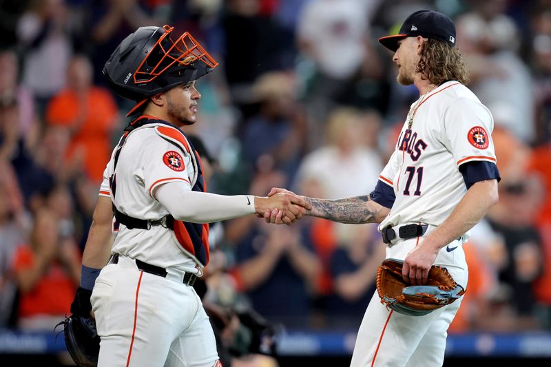 Sep 12, 2024; Houston, Texas, USA; Houston Astros catcher Yainer Diaz (21) and Houston Astros relief pitcher Josh Hader (71) congratulate each other after the final out against the Oakland Athletics during the ninth inning at Minute Maid Park. Mandatory Credit: Erik Williams-Imagn Images