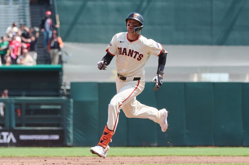 Apr 10, 2024; San Francisco, California, USA; San Francisco Giants shortstop Nick Ahmed (16) runs to third base with a triple against the Washington Nationals during the second inning at Oracle Park. Mandatory Credit: Robert Edwards-USA TODAY Sports