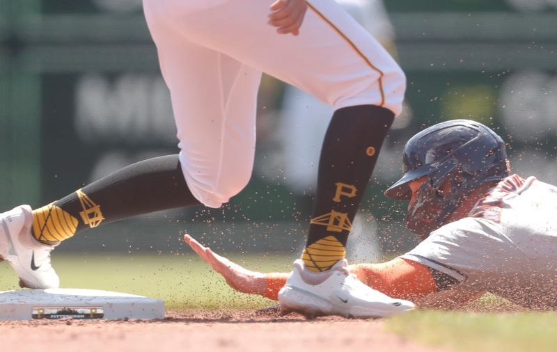 Apr 12, 2023; Pittsburgh, Pennsylvania, USA;  Houston Astros center fielder Chas McCormick (20) (right) steals second base against the Pittsburgh Pirates during the third inning at PNC Park. Mandatory Credit: Charles LeClaire-USA TODAY Sports