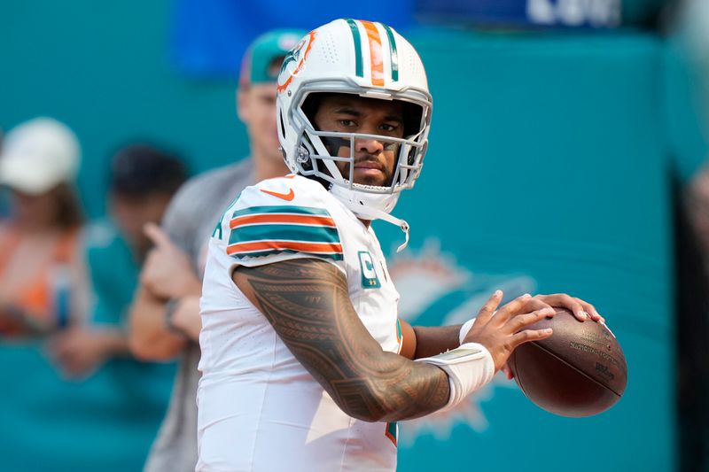 Miami Dolphins quarterback Tua Tagovailoa warms up before the start of an NFL football game against the New England Patriots, Monday, Sunday, Oct. 29, 2023 in Miami Gardens, Fla. (AP Photo/Wilfredo Lee)