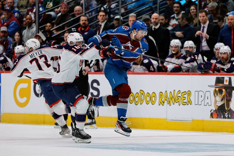 Mar 22, 2024; Denver, Colorado, USA; Colorado Avalanche left wing Miles Wood (28) and Columbus Blue Jackets center Brendan Gaunce (16) get tied up in the second period at Ball Arena. Mandatory Credit: Isaiah J. Downing-USA TODAY Sports