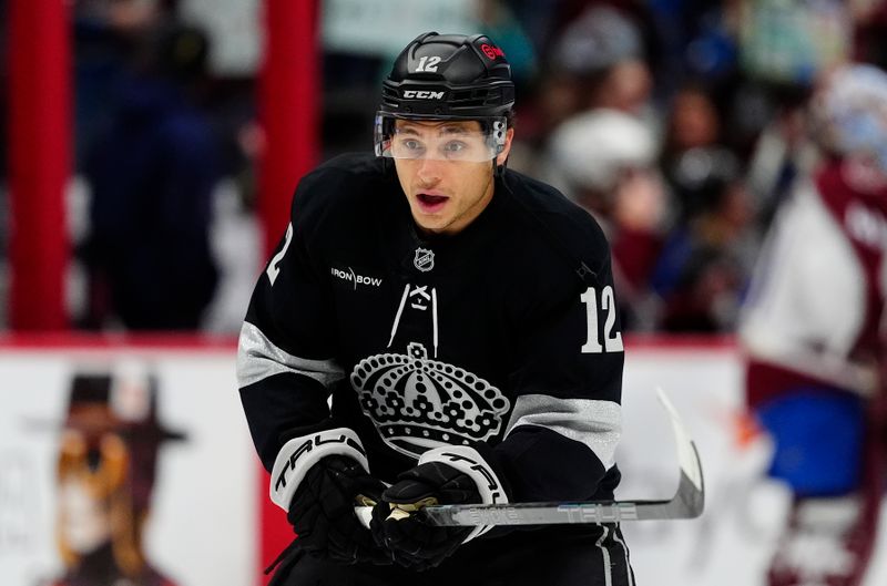 Dec 29, 2025; Denver, Colorado, USA; Los Angeles Kings left wing Trevor Moore (12) before a game against the Colorado Avalanche at Ball Arena. Mandatory Credit: Ron Chenoy-Imagn Images