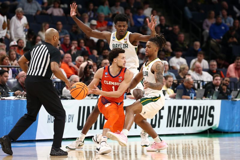 Mar 24, 2024; Memphis, TN, USA; Clemson Tigers guard Chase Hunter (1) controls the ball against Baylor Bears guard Jayden Nunn (2) and center Yves Missi (21) in the second half in the second round of the 2024 NCAA Tournament at FedExForum. Mandatory Credit: Petre Thomas-USA TODAY Sports