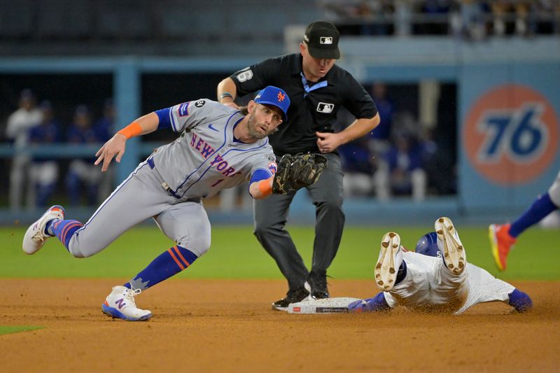 Oct 20, 2024; Los Angeles, California, USA; Los Angeles Dodgers outfielder Mookie Betts (50) steals second base against New York Mets second baseman Jeff McNeil (1) in the fourth inning during game six of the NLCS for the 2024 MLB playoffs at Dodger Stadium. Mandatory Credit: Jayne Kamin-Oncea-Imagn Images