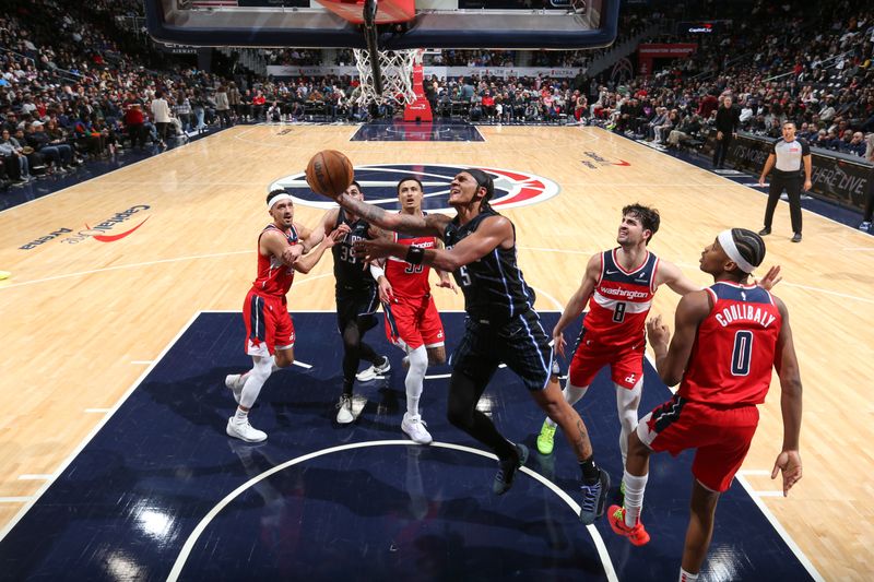 WASHINGTON, DC -? MARCH 6:  Paolo Banchero #5 of the Orlando Magic goes to the basket during the game on March 6, 2024 at Capital One Arena in Washington, DC. NOTE TO USER: User expressly acknowledges and agrees that, by downloading and or using this Photograph, user is consenting to the terms and conditions of the Getty Images License Agreement. Mandatory Copyright Notice: Copyright 2024 NBAE (Photo by Stephen Gosling/NBAE via Getty Images)