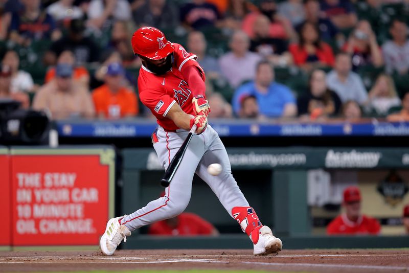 May 20, 2024; Houston, Texas, USA; Los Angeles Angels second base Luis Rengifo (2) hits a single against the Houston Astros during the first inning at Minute Maid Park. Mandatory Credit: Erik Williams-USA TODAY Sports