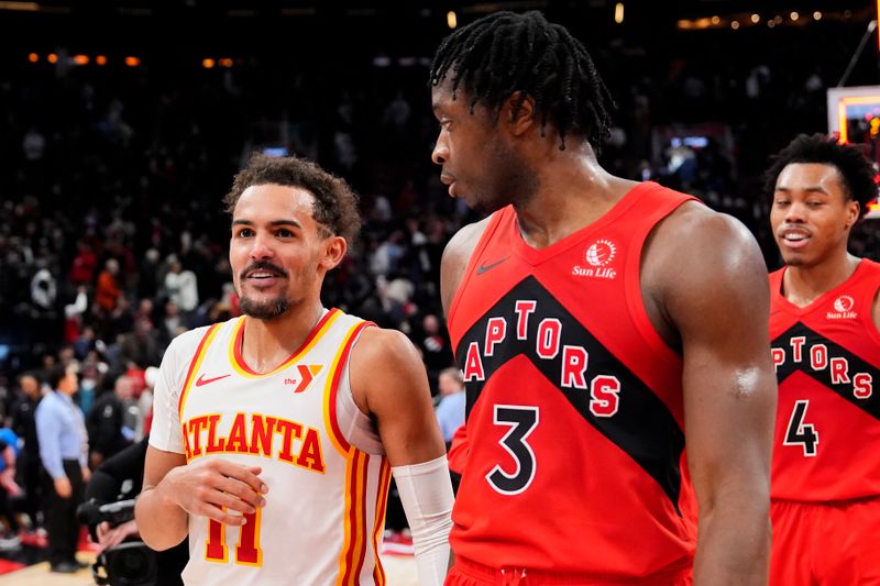 TORONTO, ON - DECEMBER 13: Trae Young #11 of the Atlanta Hawks reacts after the game while talking with O.G. Anunoby #3 of the Toronto Raptors at Scotiabank Arena on December 13, 2023 in Toronto, Ontario, Canada. NOTE TO USER: User expressly acknowledges and agrees that, by downloading and/or using this Photograph, user is consenting to the terms and conditions of the Getty Images License Agreement. (Photo by Andrew Lahodynskyj/Getty Images)