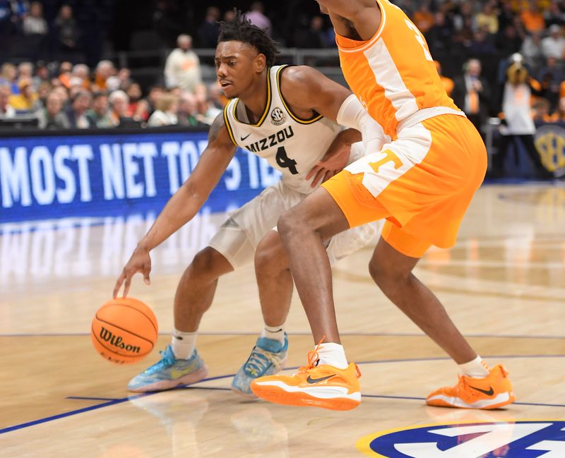 Mar 10, 2023; Nashville, TN, USA;  Missouri Tigers guard DeAndre Gholston (4) dribbles against the Tennessee Volunteers during the second half at Bridgestone Arena. Mandatory Credit: Steve Roberts-USA TODAY Sports