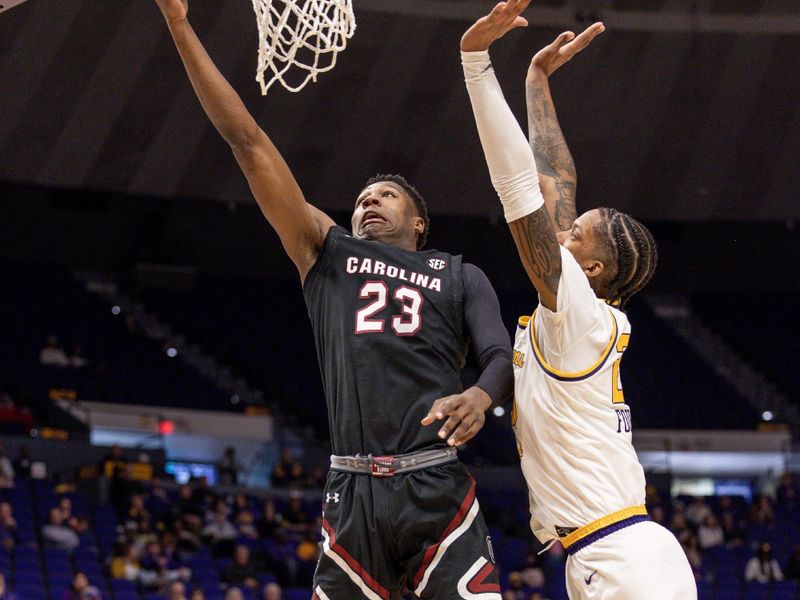 Feb 18, 2023; Baton Rouge, Louisiana, USA; South Carolina Gamecocks forward Gregory Jackson II (23) drives to the basket against LSU Tigers forward Derek Fountain (20) during the second half at Pete Maravich Assembly Center. Mandatory Credit: Stephen Lew-USA TODAY Sports