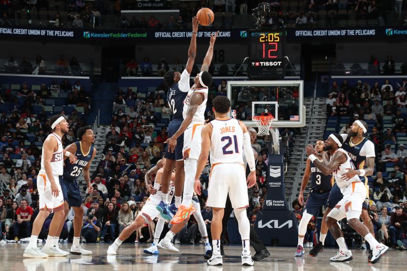 NEW ORLEANS, LA - DECEMBER 5: Antonio Reeves #12 of the New Orleans Pelicans and Bradley Beal #3 of the Phoenix Suns go up for a jump ball on December 5, 2024 at the Smoothie King Center in New Orleans, Louisiana. NOTE TO USER: User expressly acknowledges and agrees that, by downloading and or using this Photograph, user is consenting to the terms and conditions of the Getty Images License Agreement. Mandatory Copyright Notice: Copyright 2024 NBAE (Photo by Layne Murdoch Jr./NBAE via Getty Images)