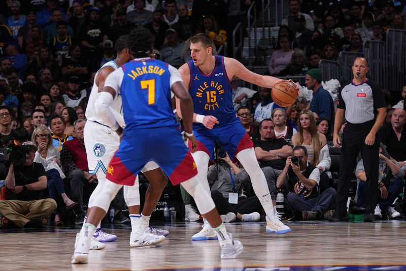 DENVER, CO - MARCH 29: Nikola Jokic #15 of the Denver Nuggets dribbles the ball during the game against the Minnesota Timberwolves on March 29, 2024 at the Ball Arena in Denver, Colorado. NOTE TO USER: User expressly acknowledges and agrees that, by downloading and/or using this Photograph, user is consenting to the terms and conditions of the Getty Images License Agreement. Mandatory Copyright Notice: Copyright 2024 NBAE (Photo by Bart Young/NBAE via Getty Images)