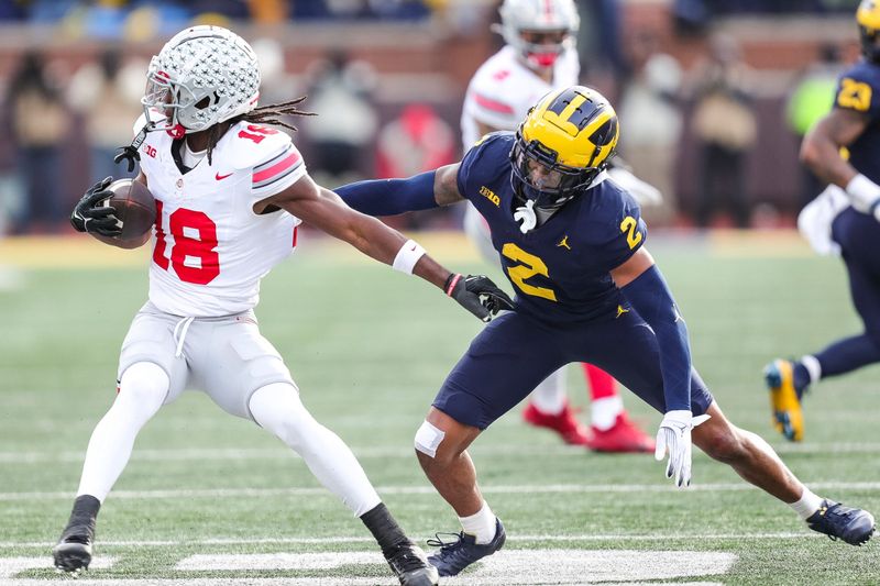 Nov 25, 2023; Ann Arbor, MI, USA;  Michigan defensive back Will Johnson defends Ohio State receiver Marvin Harrison Jr. during the second half at Michigan Stadium in Ann Arbor on Saturday, Nov. 25, 2023. Mandatory Credit: Junfu Han-USA TODAY Sports