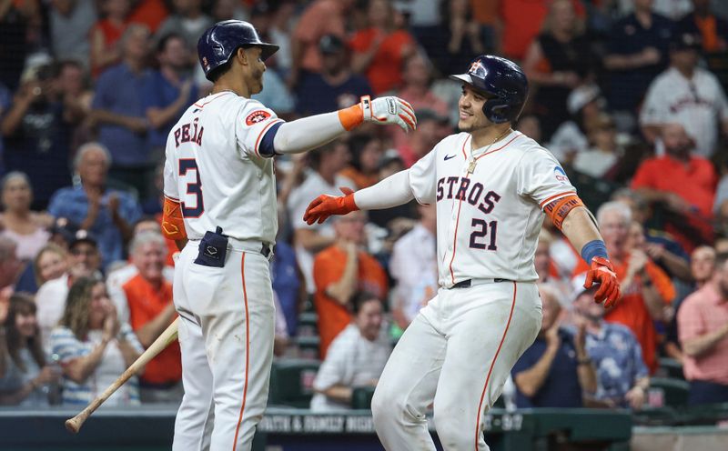 Aug 20, 2024; Houston, Texas, USA; Houston Astros catcher Yainer Diaz (21) celebrates with shortstop Jeremy Pena (3) after hitting a home run during the fifth inning against the Boston Red Sox at Minute Maid Park. Mandatory Credit: Troy Taormina-USA TODAY Sports
