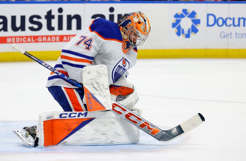 Mar 9, 2024; Buffalo, New York, USA;  Edmonton Oilers goaltender Stuart Skinner (74) makes a save during the second period against the Buffalo Sabres at KeyBank Center. Mandatory Credit: Timothy T. Ludwig-USA TODAY Sports