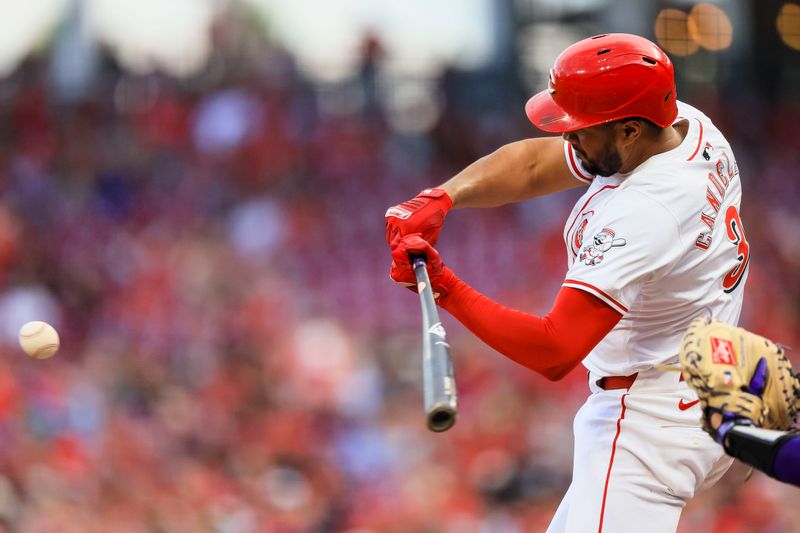 Jul 8, 2024; Cincinnati, Ohio, USA; Cincinnati Reds third baseman Jeimer Candelario (3) hits a single against the Colorado Rockies in the fourth inning at Great American Ball Park. Mandatory Credit: Katie Stratman-USA TODAY Sports