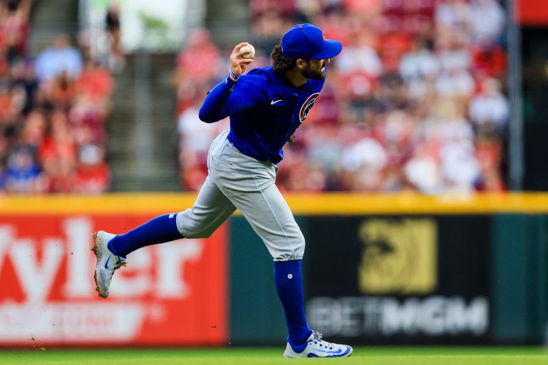 Jul 31, 2024; Cincinnati, Ohio, USA; Chicago Cubs shortstop Dansby Swanson (7) throws to first to get Cincinnati Reds third baseman Santiago Espinal (not pictured) out in the third inning at Great American Ball Park. Mandatory Credit: Katie Stratman-USA TODAY Sports