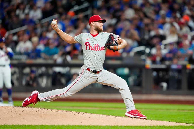 Sep 22, 2024; New York City, New York, USA;  Philadelphia Phillies pitcher Zack Wheeler (45) delivers a pitch against the New York Mets during the first inning at Citi Field. Mandatory Credit: Gregory Fisher-Imagn Images