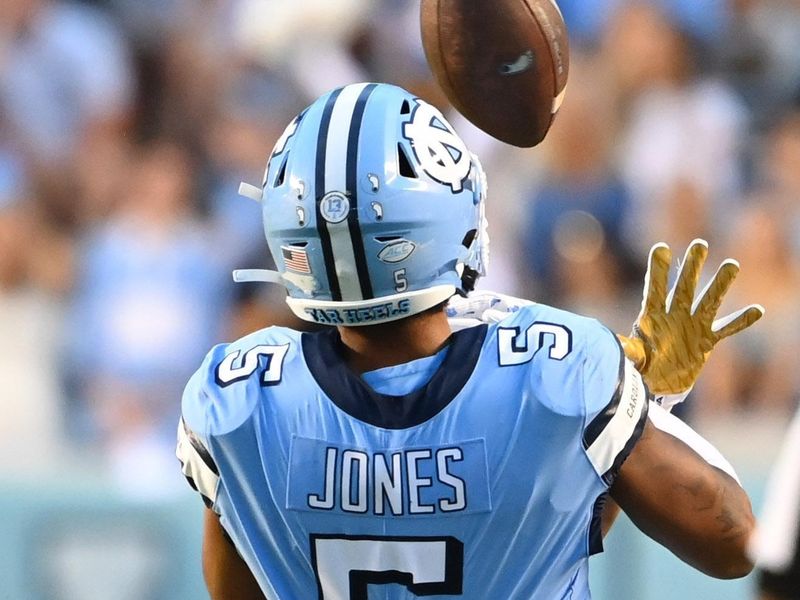 Sep 24, 2022; Chapel Hill, North Carolina, USA; Notre Dame Fighting Irish cornerback Benjamin Morrison (20) is called for pass interference as North Carolina Tar Heels wide receiver J.J. Jones (5) tries to catch the ball in the fourth quarter at Kenan Memorial Stadium. Mandatory Credit: Bob Donnan-USA TODAY Sports