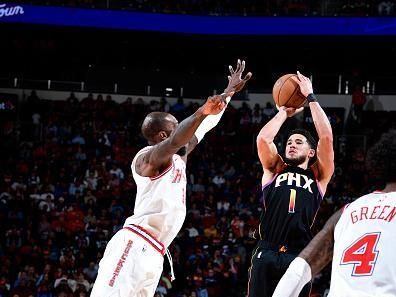 HOUSTON, TX - DECEMBER 27:   Devin Booker #1 of the Phoenix Suns shoots a three point basket after the game against the Houston Rockets on December 27, 2023 at the Toyota Center in Houston, Texas. NOTE TO USER: User expressly acknowledges and agrees that, by downloading and or using this photograph, User is consenting to the terms and conditions of the Getty Images License Agreement. Mandatory Copyright Notice: Copyright 2023 NBAE (Photo by Logan Riely/NBAE via Getty Images)