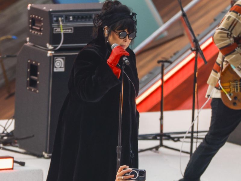 Jan 1, 2024; Seattle, Washington, USA; Two fans take a selfie as Ann Wilson of Heart peforms during the first intermission in the 2024 Winter Classic ice hockey game between the Vegas Golden Knights and Seattle Kraken at T-Mobile Park. Mandatory Credit: Joe Nicholson-USA TODAY Sports