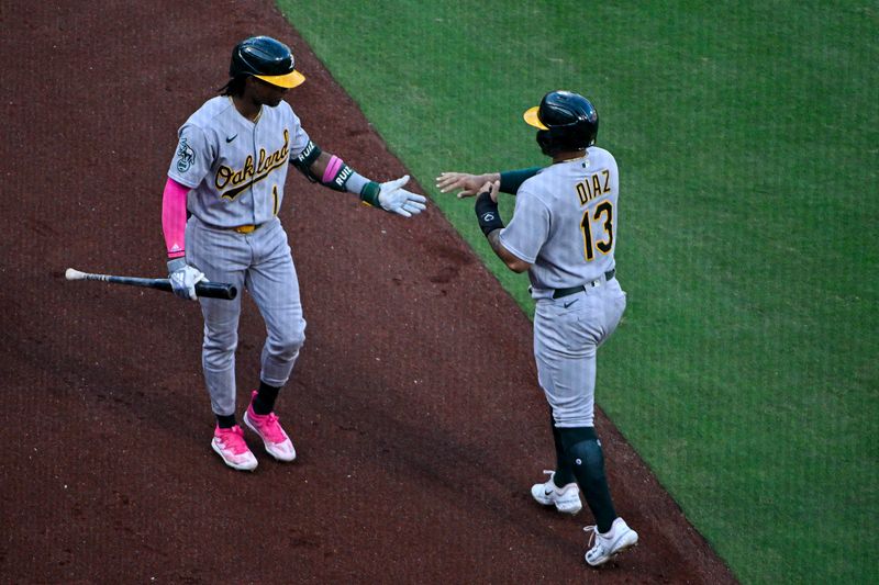 Aug 16, 2023; St. Louis, Missouri, USA;  Oakland Athletics third baseman Jordan Diaz (13) is congratulated by center fielder Esteury Ruiz (1) after scoring against the St. Louis Cardinals during the first inning at Busch Stadium. Mandatory Credit: Jeff Curry-USA TODAY Sports