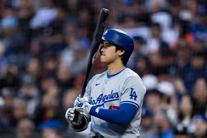 May 15, 2024; San Francisco, California, USA; Los Angeles Dodgers designated hitter Shohei Ohtani (17) on deck before batting against the San Francisco Giants during the fifth inning at Oracle Park. Mandatory Credit: John Hefti-USA TODAY Sports