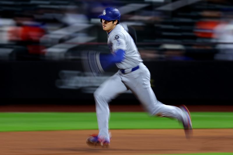 May 23, 2025; New York City, New York, USA; Los Angeles Dodgers designated hitter Shohei Ohtani (17) attempts to steal second base against the New York Mets during the ninth inning at Citi Field. Ohtani was thrown out at second. Mandatory Credit: Brad Penner-Imagn Images