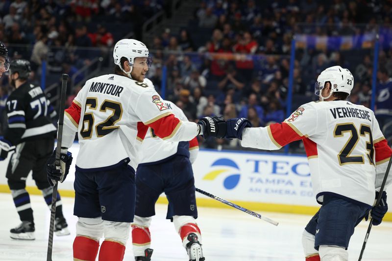 Feb 17, 2024; Tampa, Florida, USA;  Florida Panthers defenseman Brandon Montour (62) and center Carter Verhaeghe (23) celebrate a goal against the Tampa Bay Lightning in the second period at Amalie Arena. Mandatory Credit: Nathan Ray Seebeck-USA TODAY Sports