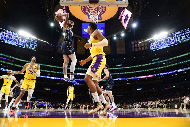 LOS ANGELES, CA - JANUARY 17: Derrick Jones Jr. #55 of the Dallas Mavericks dunks the ball during the game against the Los Angeles Lakers on January 17, 2024 at Crypto.Com Arena in Los Angeles, California. NOTE TO USER: User expressly acknowledges and agrees that, by downloading and/or using this Photograph, user is consenting to the terms and conditions of the Getty Images License Agreement. Mandatory Copyright Notice: Copyright 2024 NBAE (Photo by Adam Pantozzi/NBAE via Getty Images)