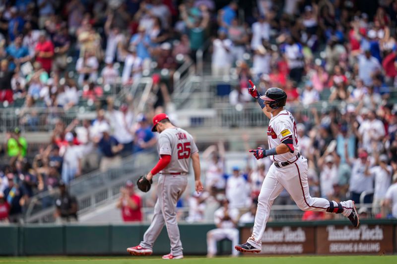 Aug 2, 2023; Cumberland, Georgia, USA; Atlanta Braves third baseman Austin Riley (27) reacts after hitting a two run home run against the Los Angeles Angels during the fourth inning at Truist Park. Mandatory Credit: Dale Zanine-USA TODAY Sports