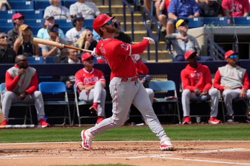 Mar 18, 2024; Phoenix, Arizona, USA; Los Angeles Angels left fielder Taylor Ward (3) hits against the Milwaukee Brewers in the first inning at American Family Fields of Phoenix. Mandatory Credit: Rick Scuteri-USA TODAY Sports