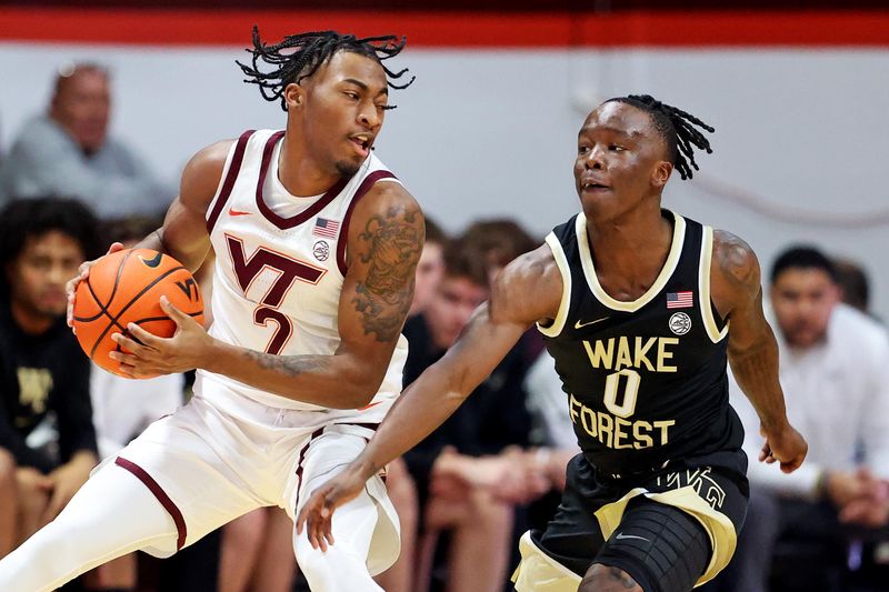 Mar 2, 2024; Blacksburg, Virginia, USA; Virginia Tech Hokies guard MJ Collins (2) handles the ball against Wake Forest Demon Deacons guard Kevin Miller (0) during the first half at Cassell Coliseum. Mandatory Credit: Peter Casey-USA TODAY Sports